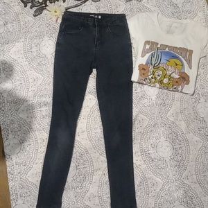 black slightly distressed skinny jeans